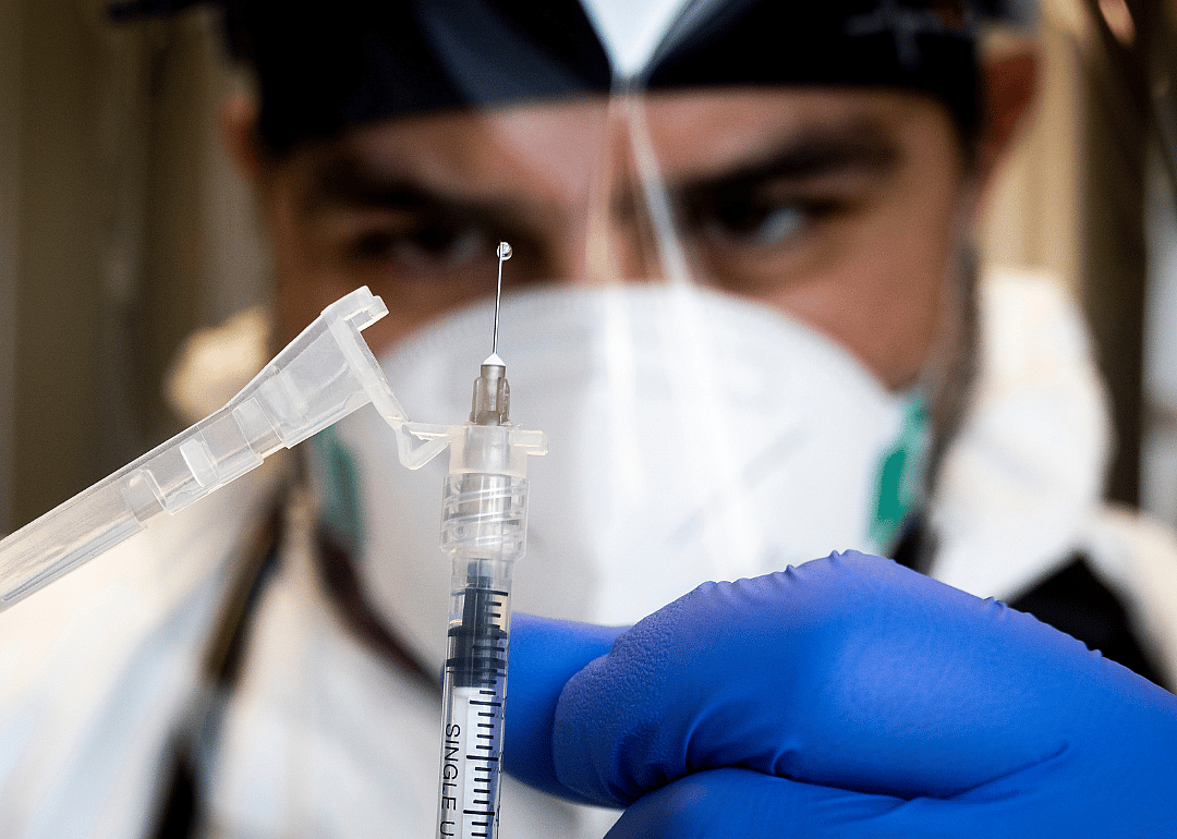 A healthcare worker preparing to administer a Monkeypox vaccine.