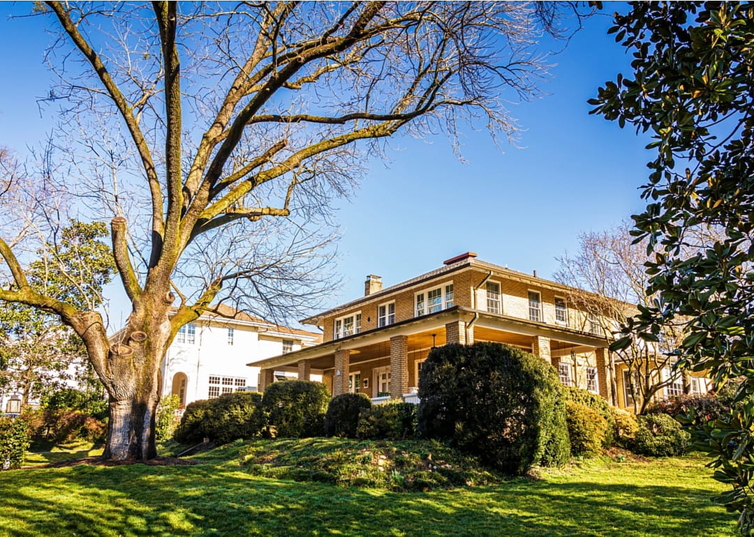 Beautiful 2 story homes with big trees and green lawns.