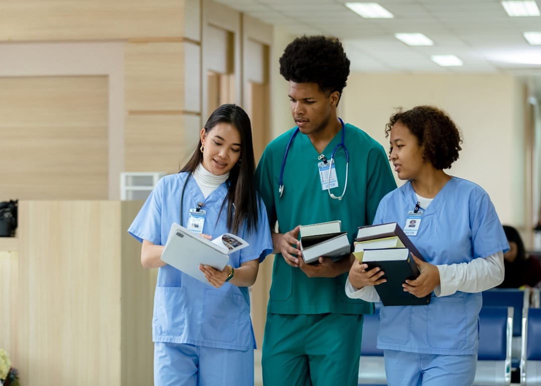 Nursing students in a hallway.