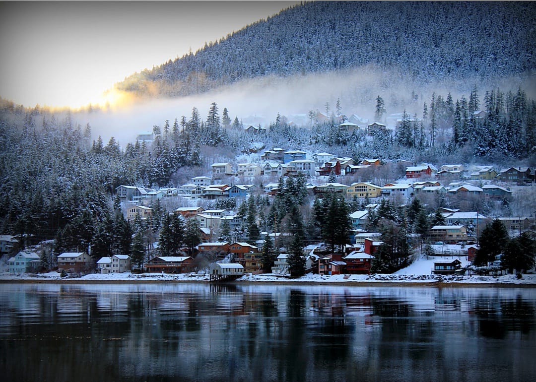 Douglas Island, Alaska homes on the water covered in snow.