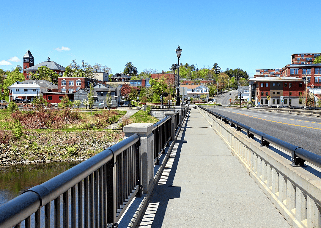 Plymouth, New Hampshire buildings and homes from the view of a pedestrian bridge.