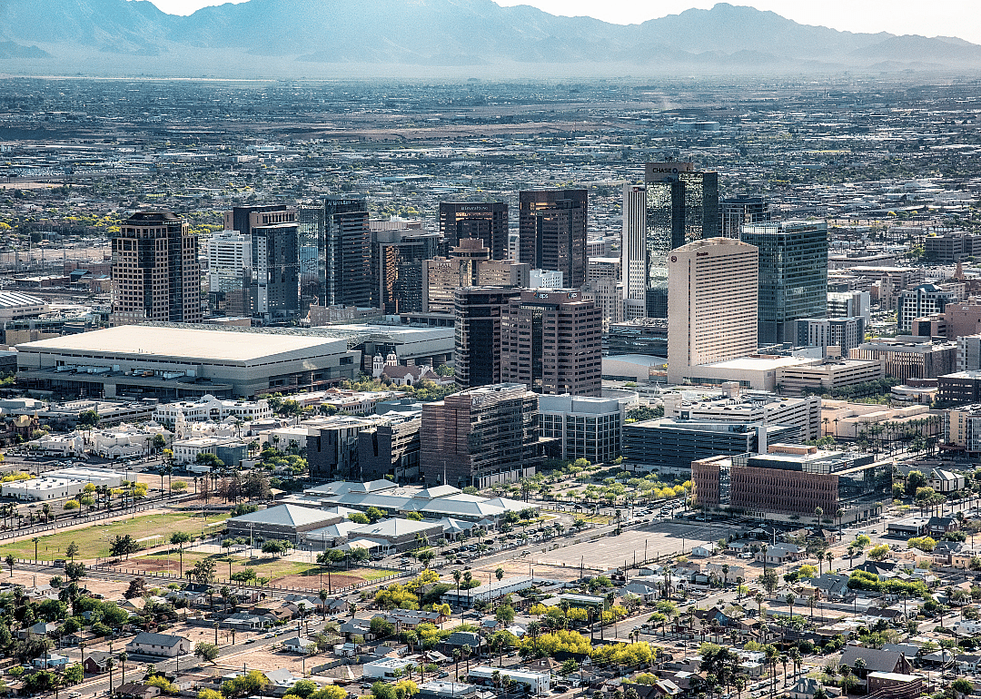 Aerial skyline of Phoenix, Arizona with mountains in the background.