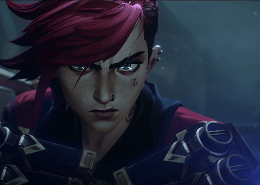 An animated character with red hair, a nose ring, and a face tattoo.