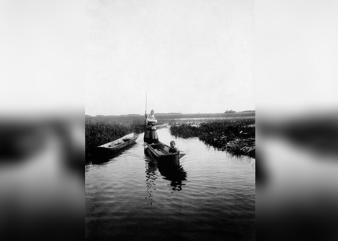 Seminole woman canoeing in the Everglades