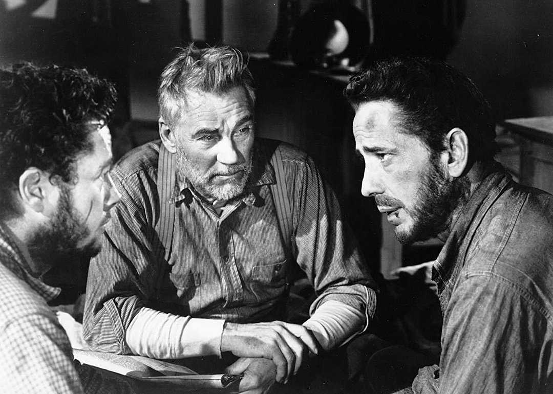 Three men having a serious conversation.