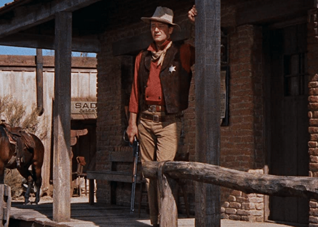 John Wayne on a porch.