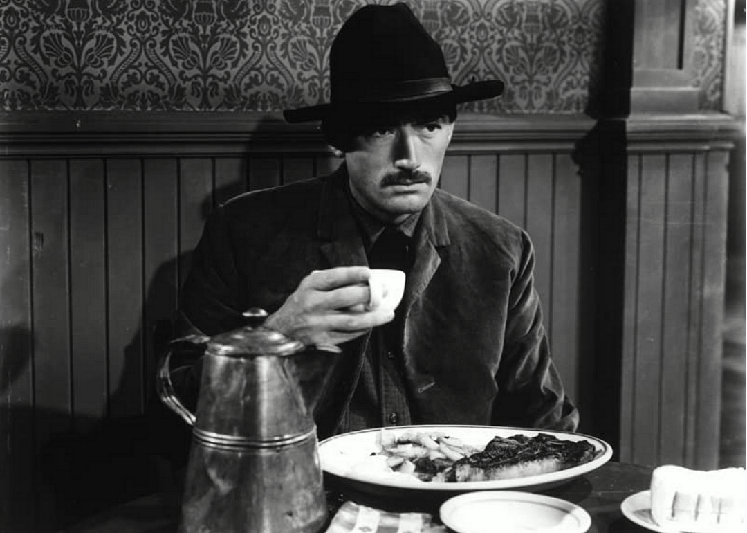 A man eating at a table.