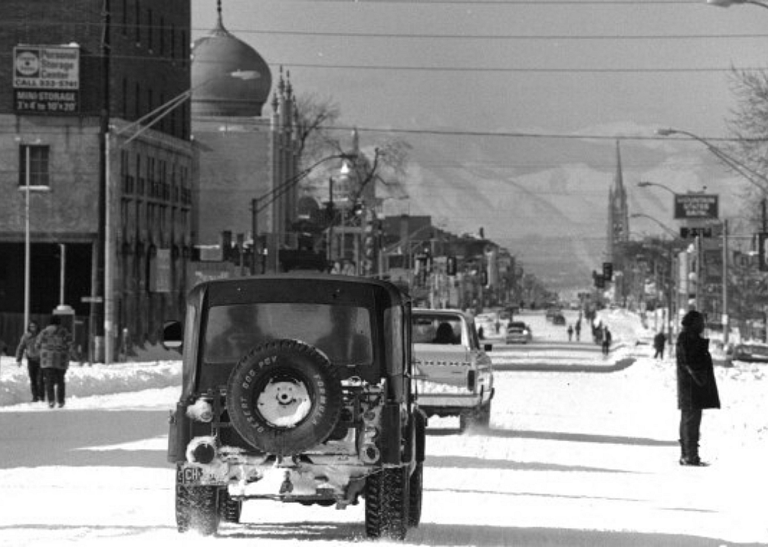 Snowy street scene with traffic.