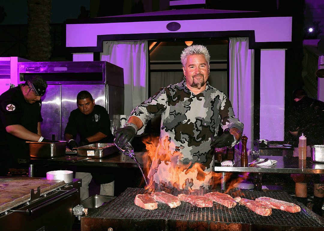 Guy Fieri grilling steaks.