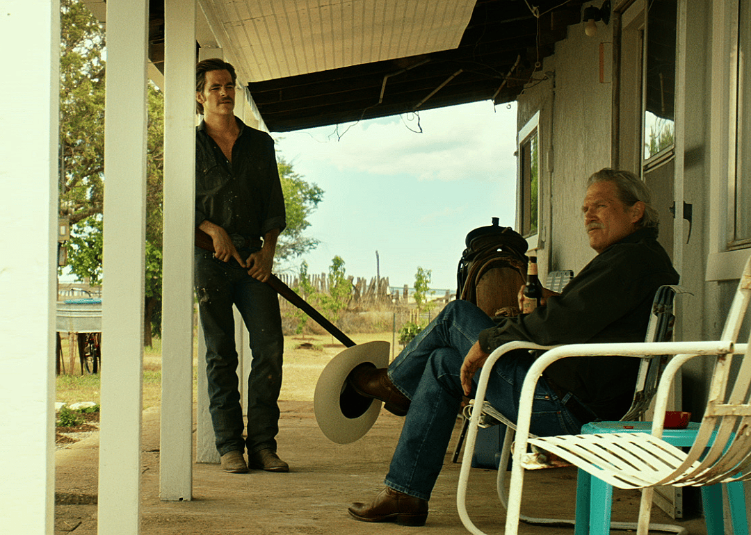 Jeff Bridges and Chris Pine on a front porch.