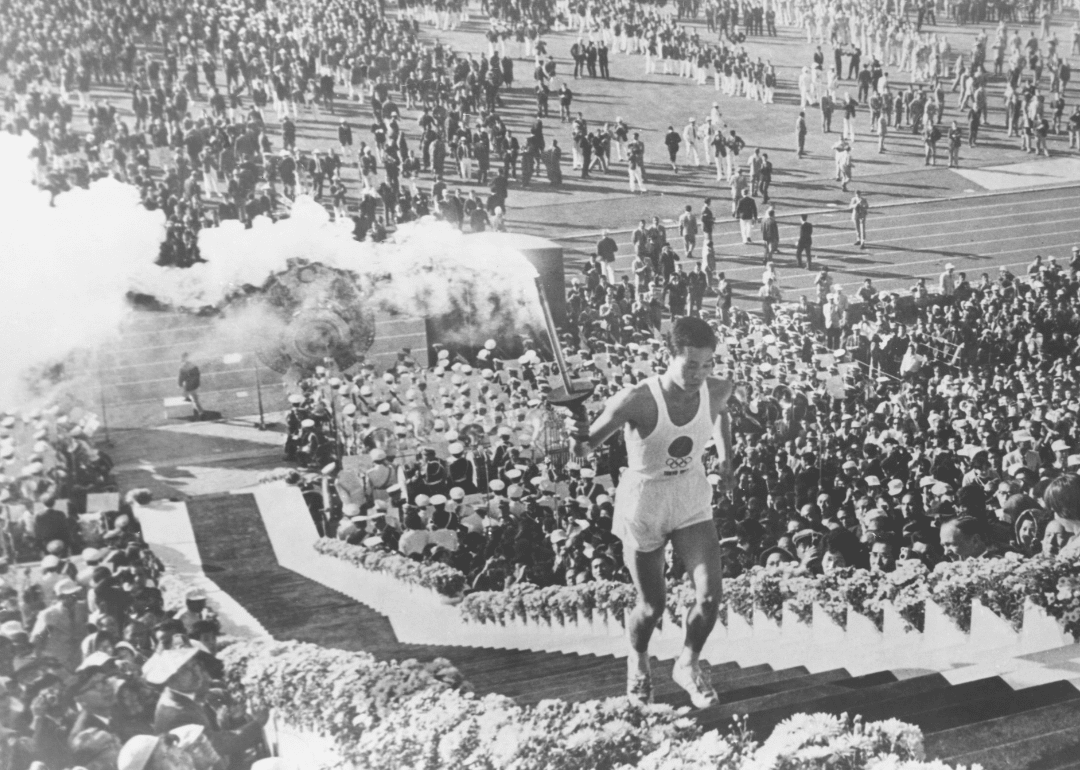Hiroshima born Yoshinori Sakai lights the Olympic cauldron