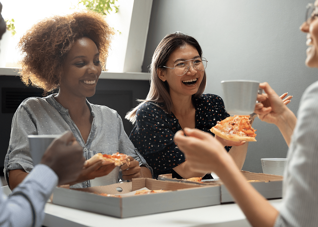 Coworkers enjoying a meal together.