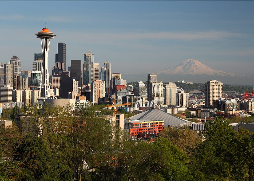 The Seattle skyline near sundown—featuring the Space Needle and Mt. Rainier