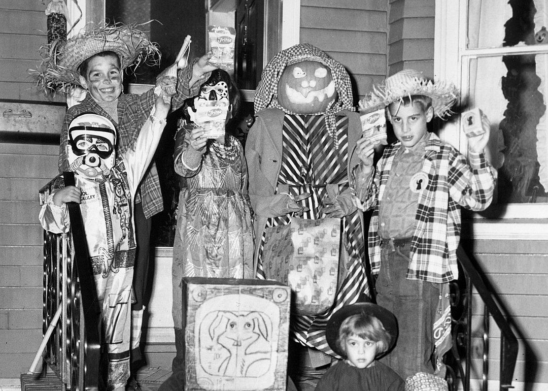 A scarecrow, jack-o'-lantern, and some friends