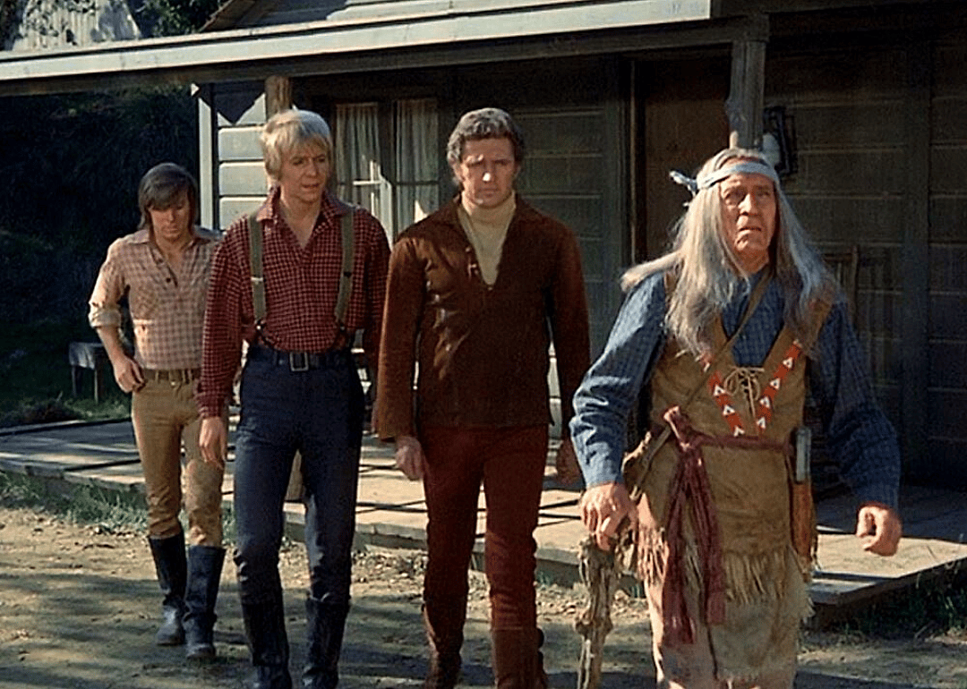 Three western men and an American Indian.
