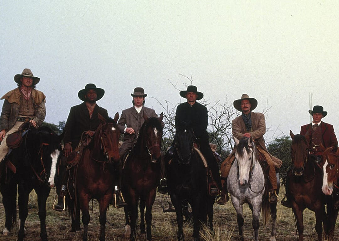 Men on horseback.