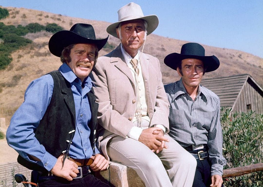 Three men in cowboy hats.
