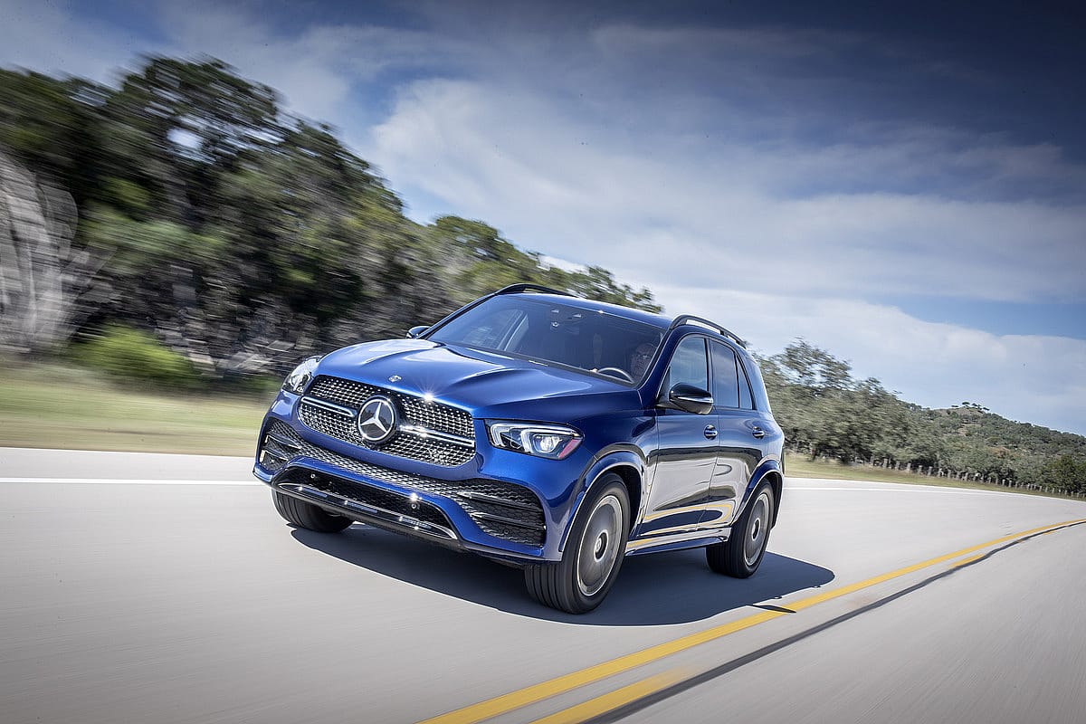 Blue Mercedes-Benz GLE 350 driving on the road.