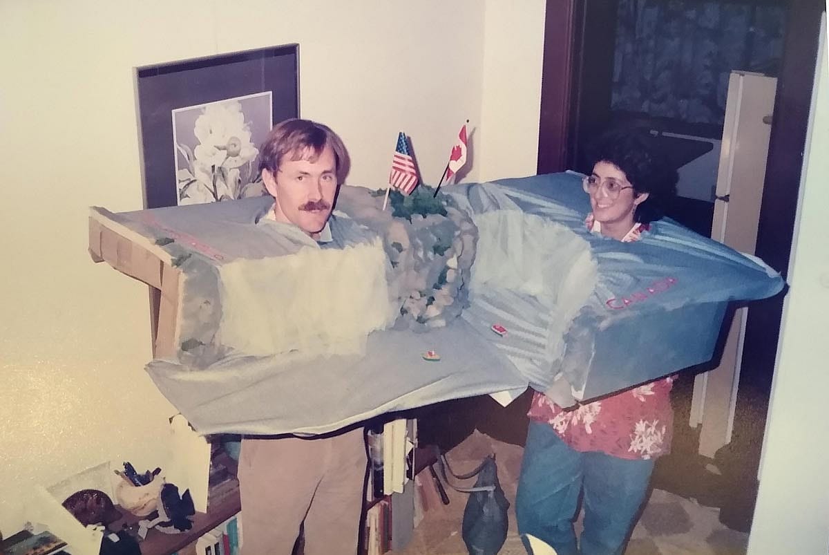 Two people in a costume of the Niagara Falls that they built