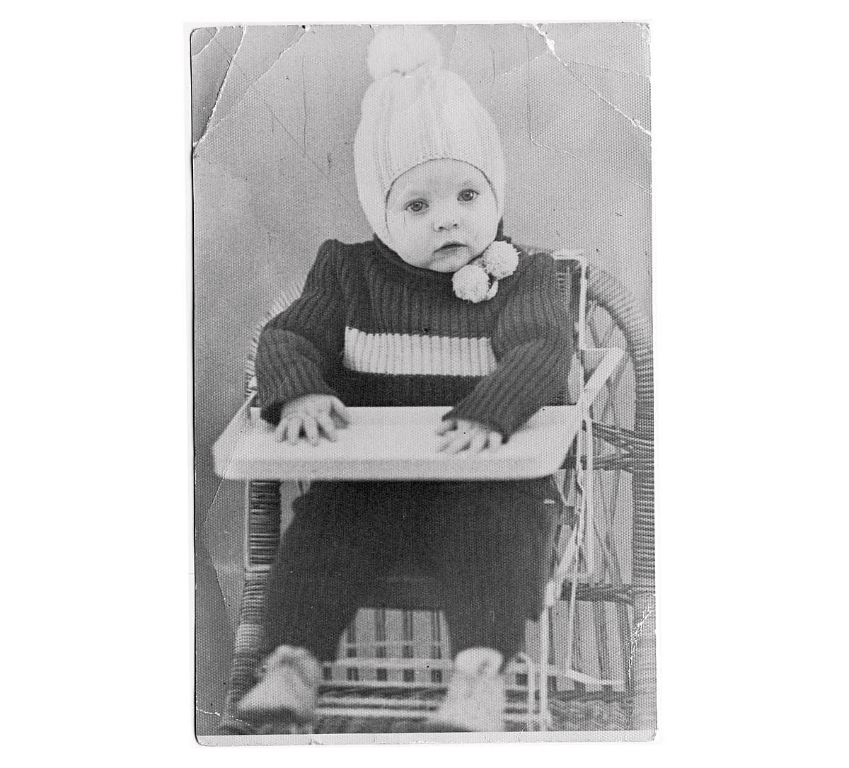 Portrait of a baby in a high chair