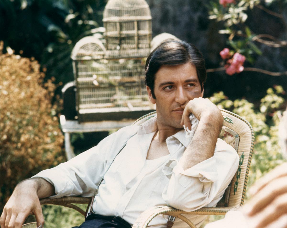 Al Pacino seated in garden as Michael Corleone from the 1972 movie The Godfather. 