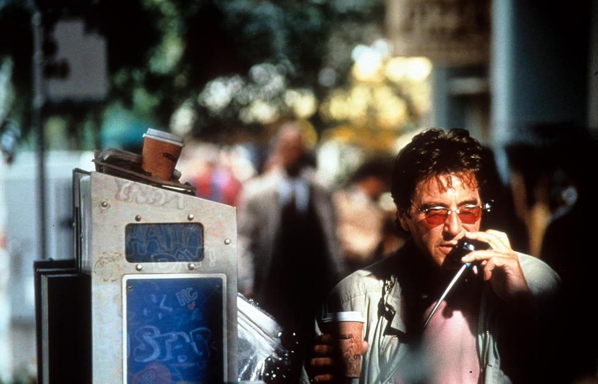 Al Pacino talks on a payphone in a scene from the film 'The Insider', 1999.