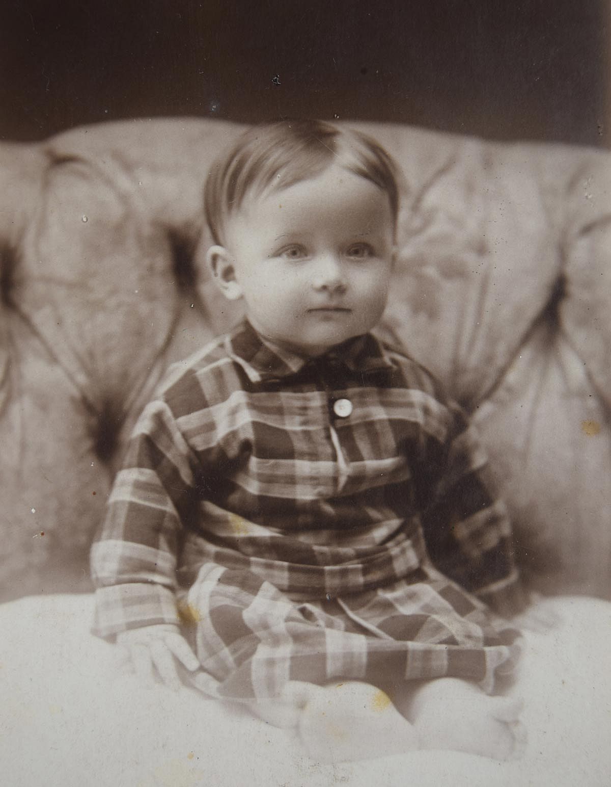 Black and white photo of a little boy