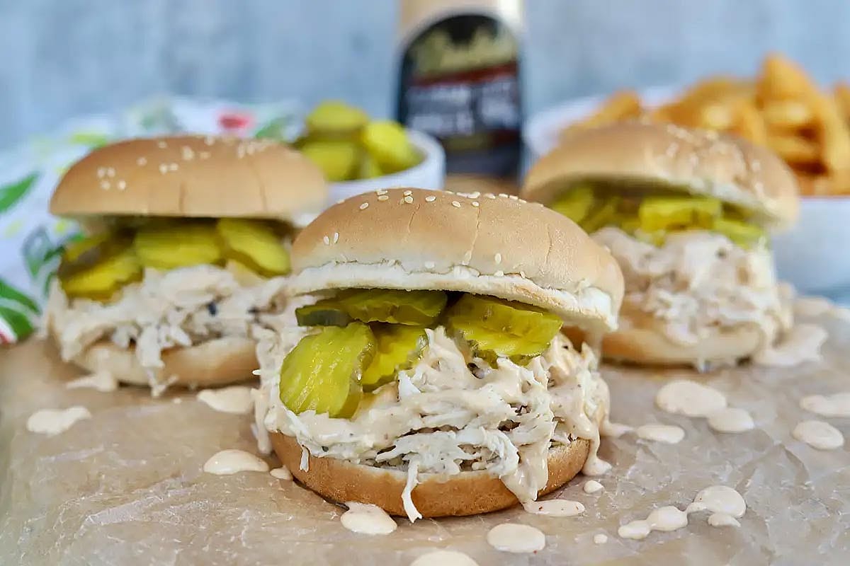 Pulled chicken sandwiches on roll.
