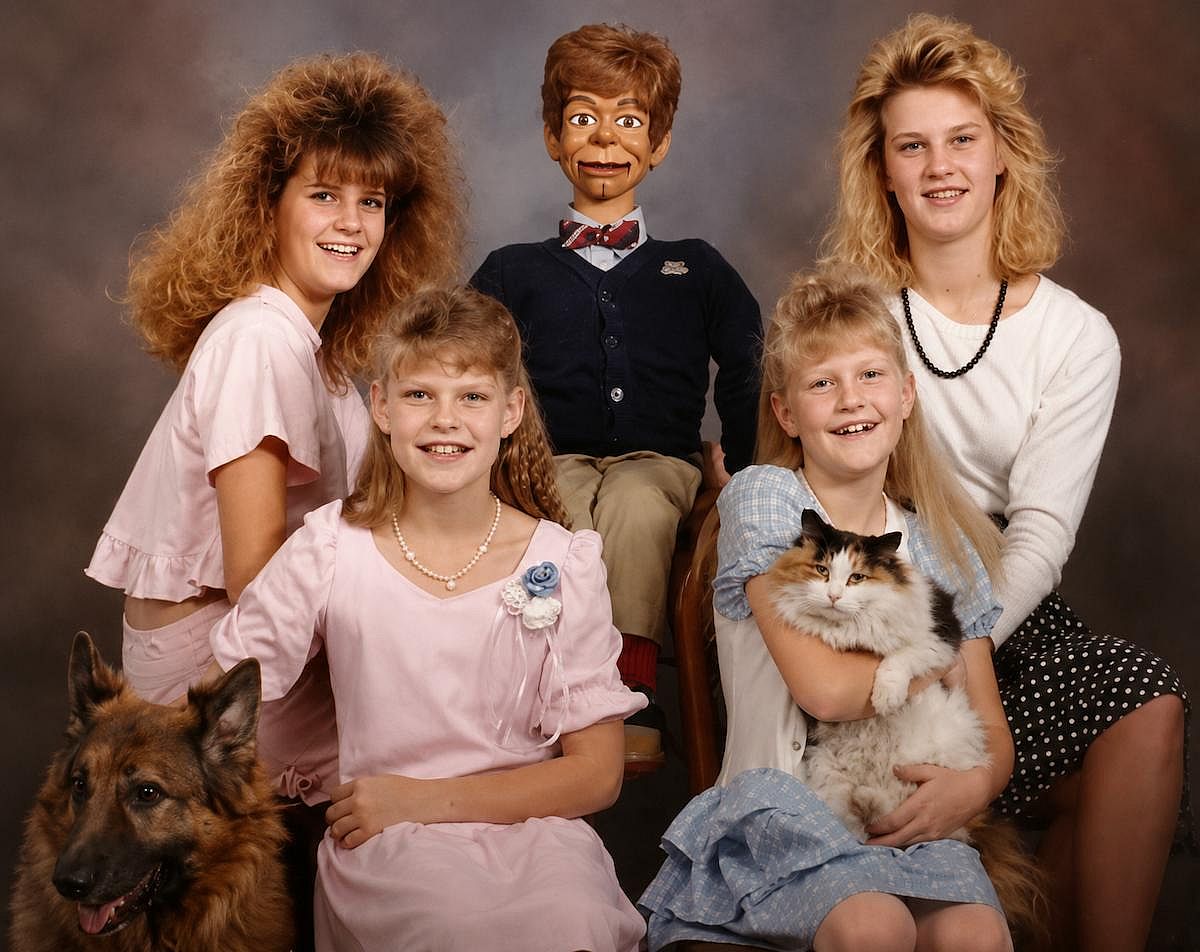 Sibling photo with a puppet.