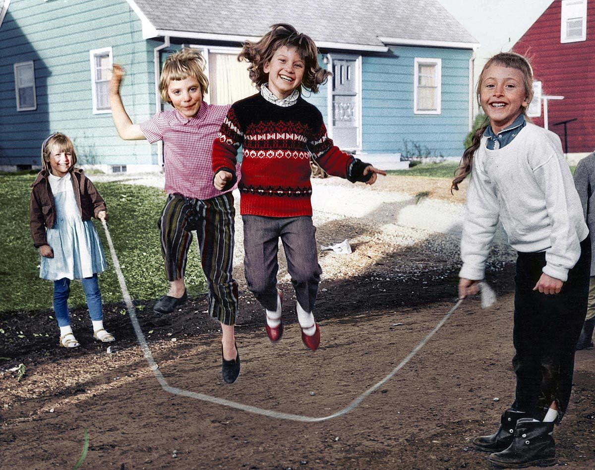Four kids playing jump rope 