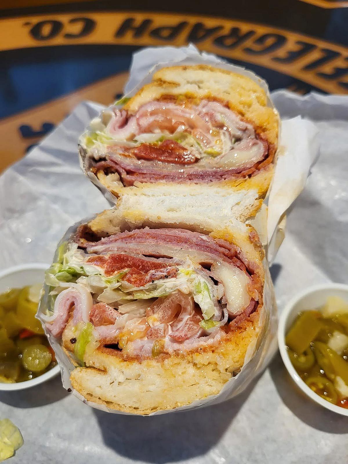 Cross section of two halves of a Lucky 7 sandwich from Potbelly