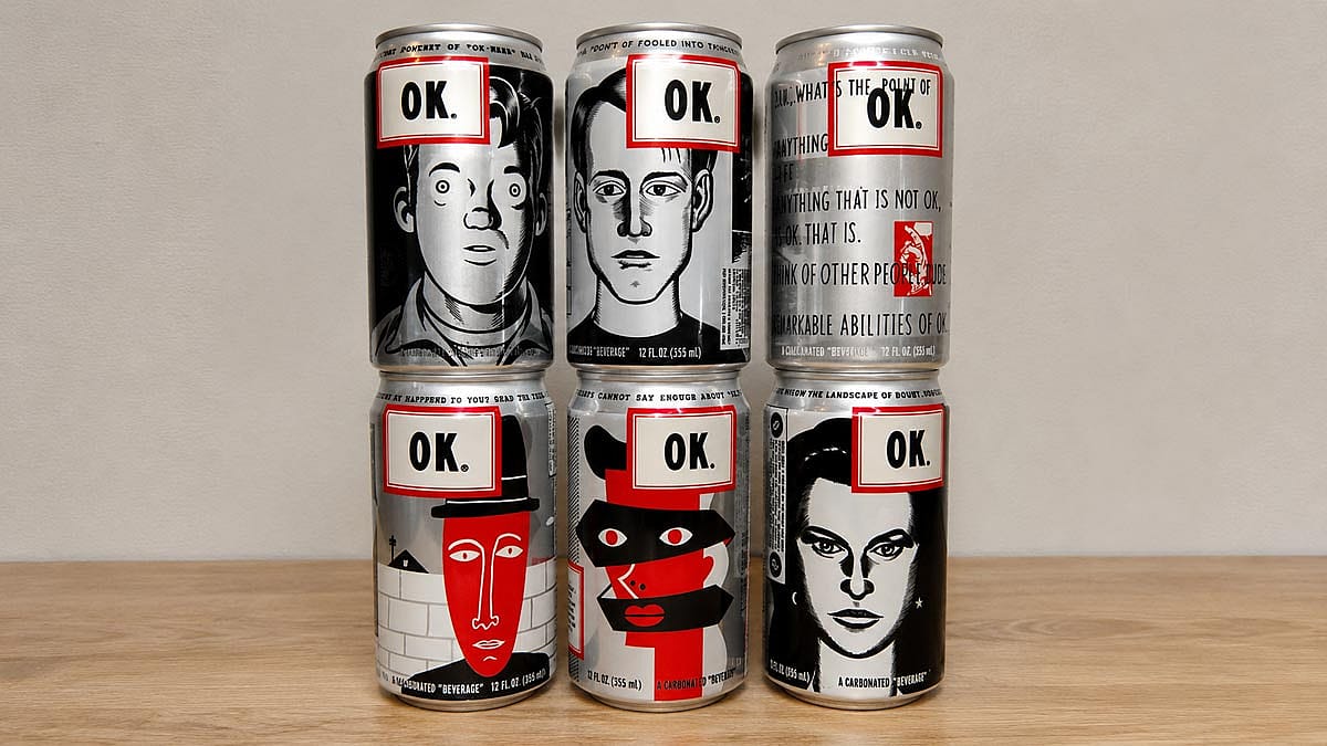 A collection of six cans of OK Soda