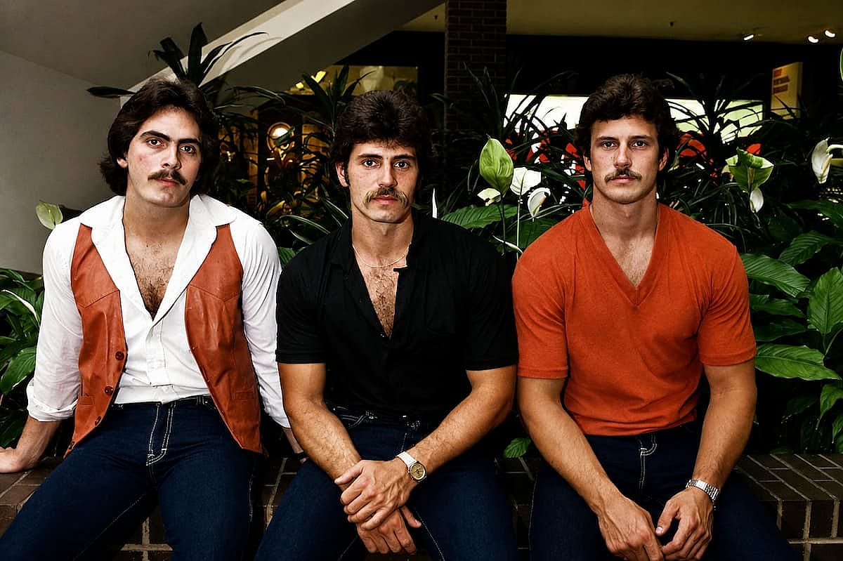 Three friends showing off the classic 1980s style.