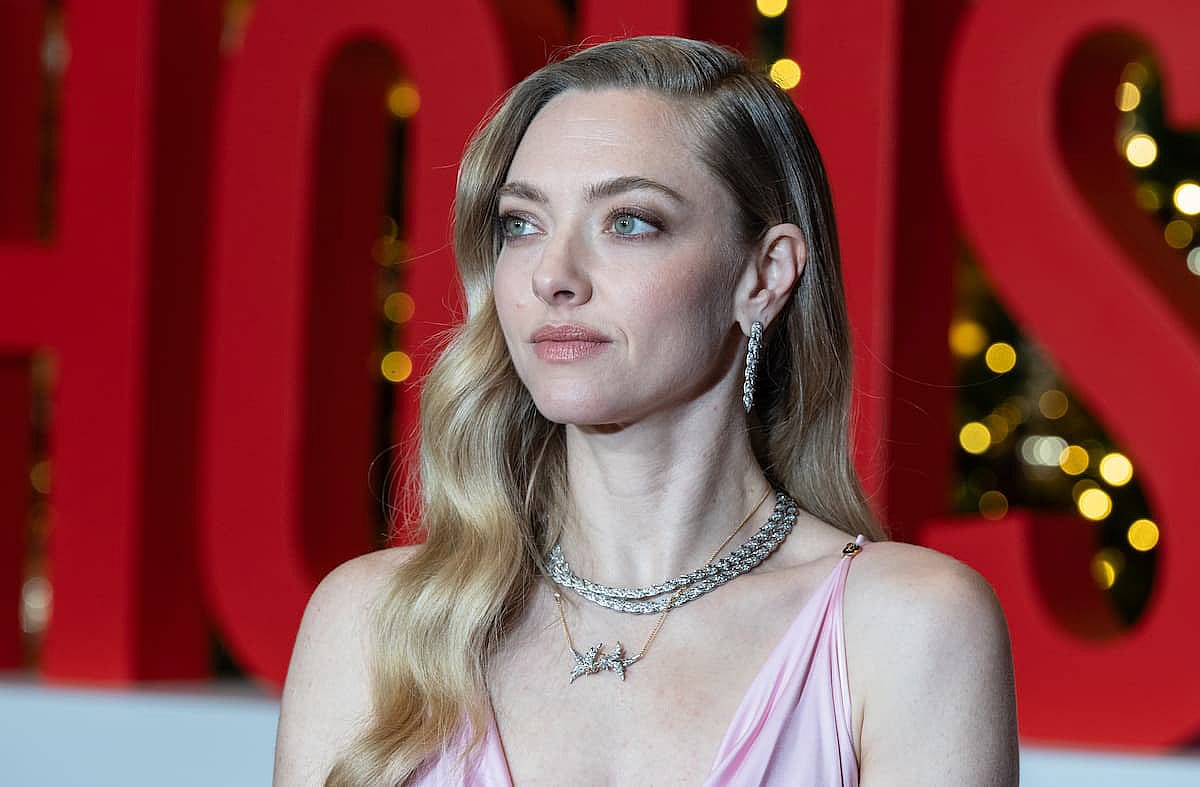 Amanda Seyfried wearing dress by Versace and jewelry by Tiffany attends premiere of 'The Housemaid' at BNP Paribas atrium in New York, NY on December 2, 2025.