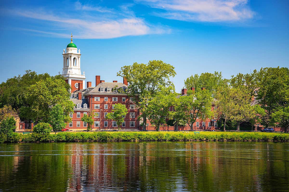 Harvard University Eliot House and tower viewed across the Charles River in Cambridge, Massachusetts