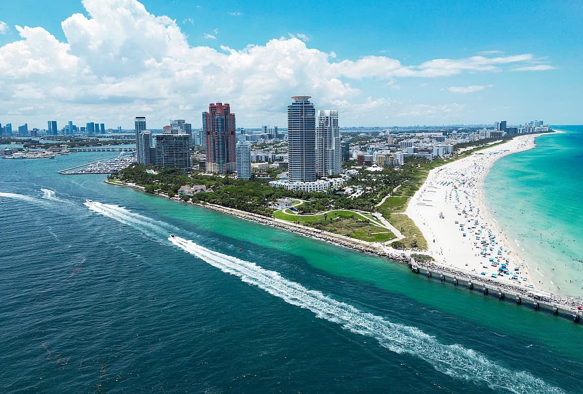 Miami Beach scene from drone, Florida, USA. Miami seaside. Aerial view of Miami Beach and cityscape. Coastline of Miami Beach, aerial view. Famous American landmarks. Summer travel in USA.
