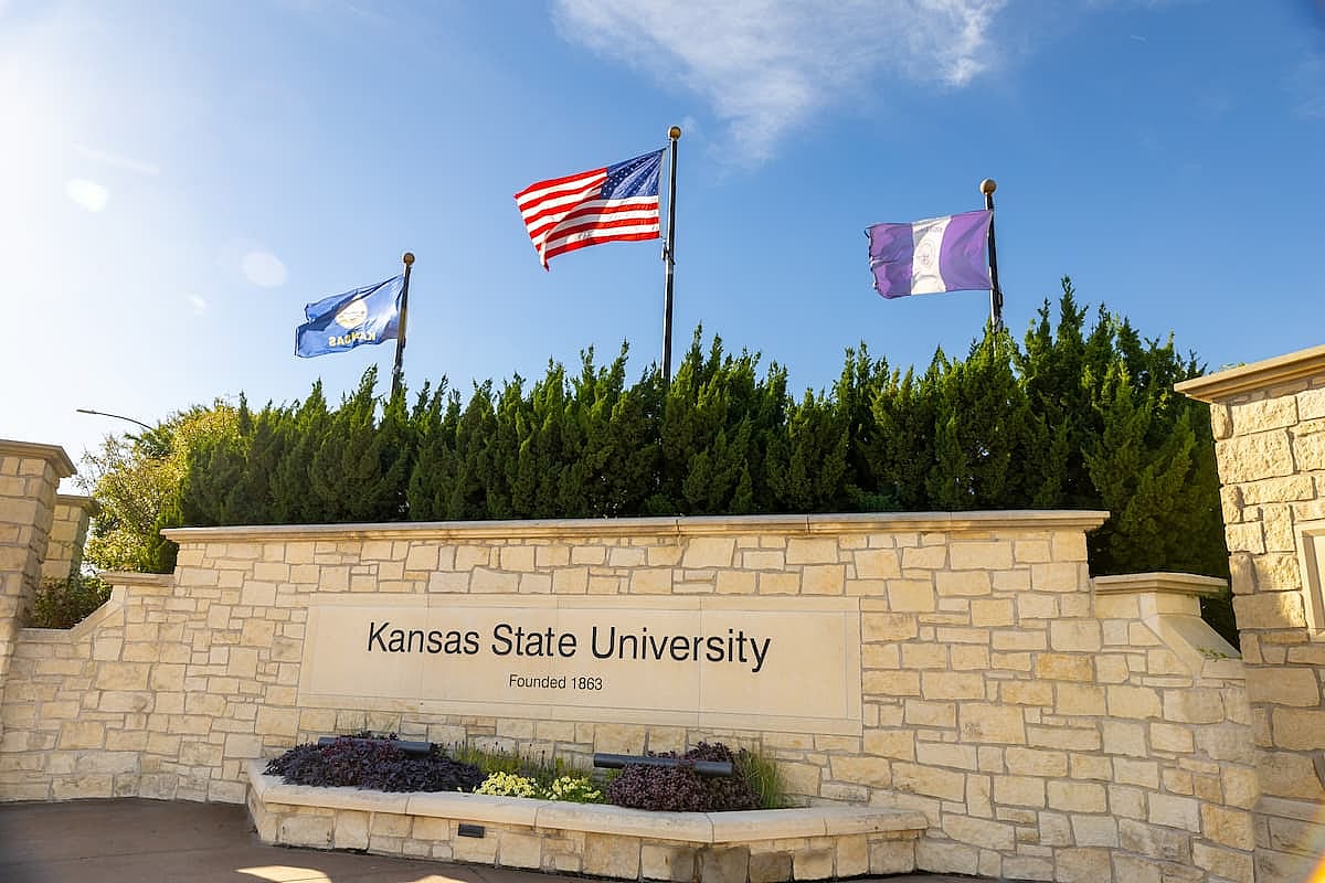 Kansas State University sign and flags