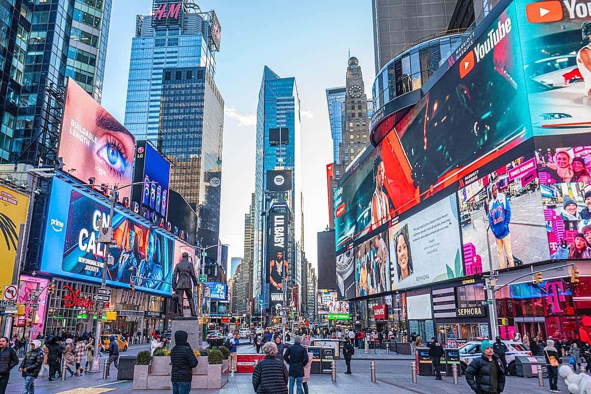 Times Square, Manhattan, New York, U.S.-January 08, 2025: tourists are visiting the Times Square with colorful lights in Manhatan. US