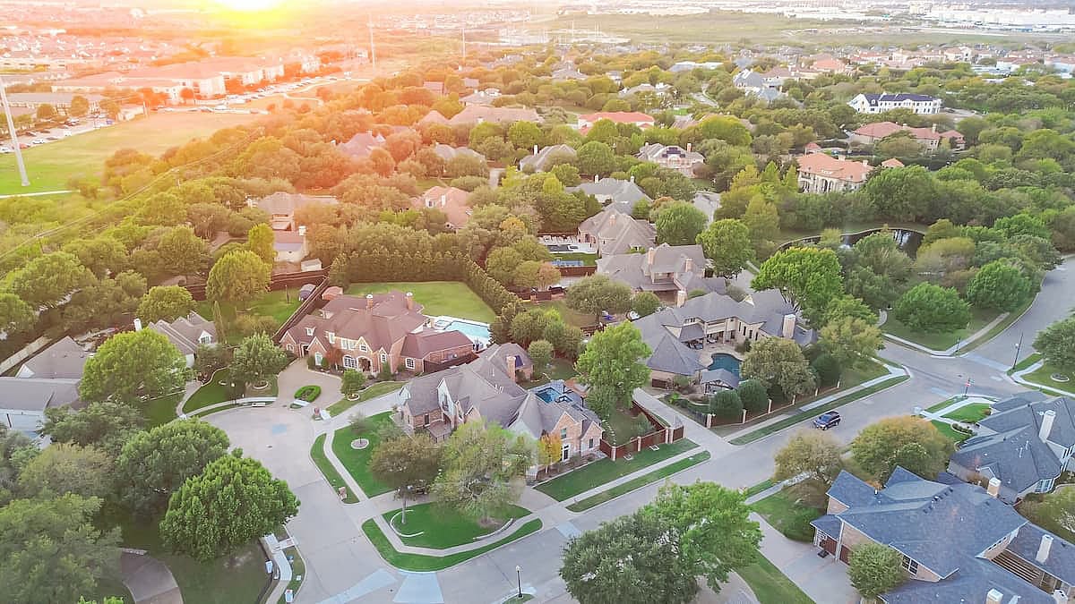 Cul-de-sac keyhole shape street in park side upscale residential neighborhood spacious two-story houses swimming pool, large backyard along McKamy Trail, Shady Brook Trail in Plano, Texas.