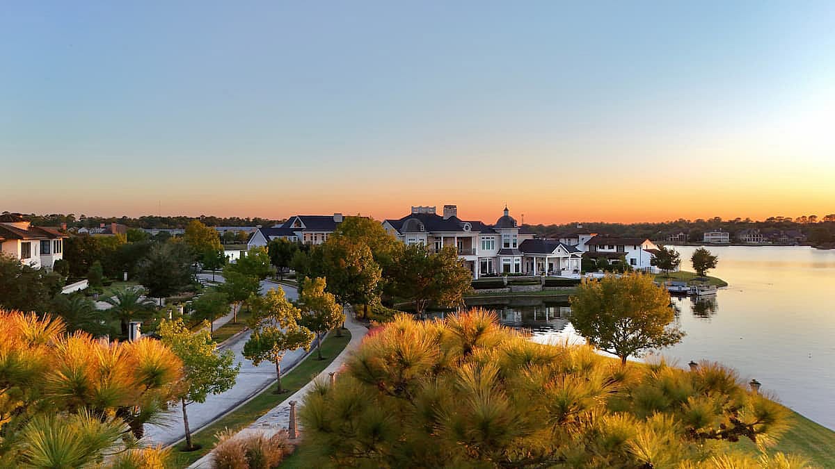 Aerial view of a peaceful neighborhood with luxurious houses by Woodlands lake , Houston, Texas