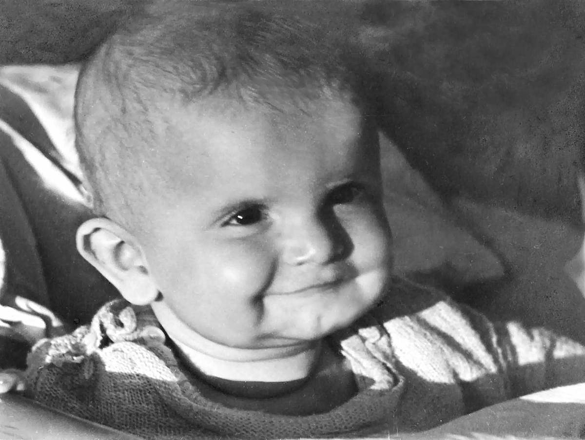 Black and white photo of a baby boy.