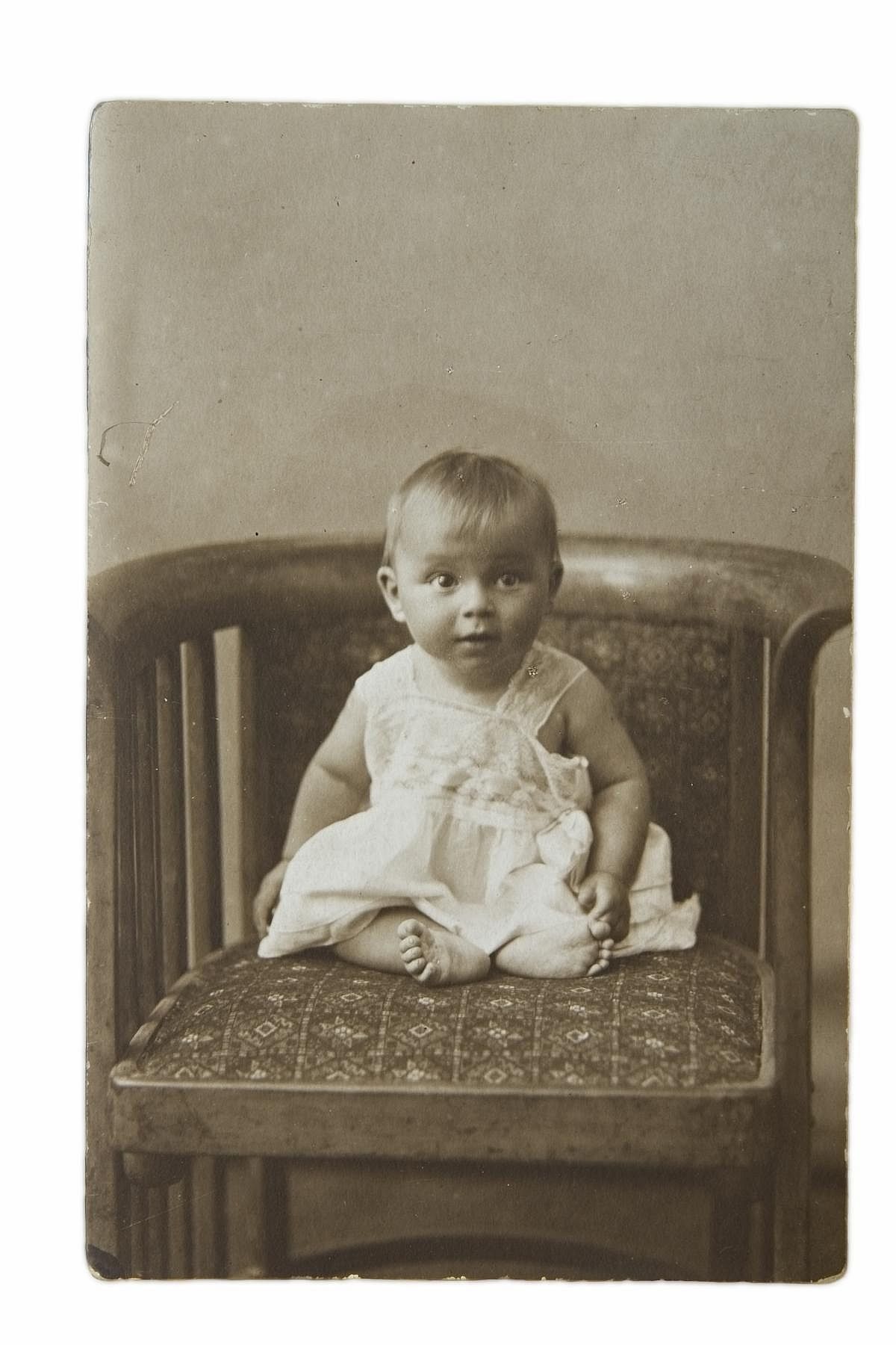 The little girl on a chair, an old photo