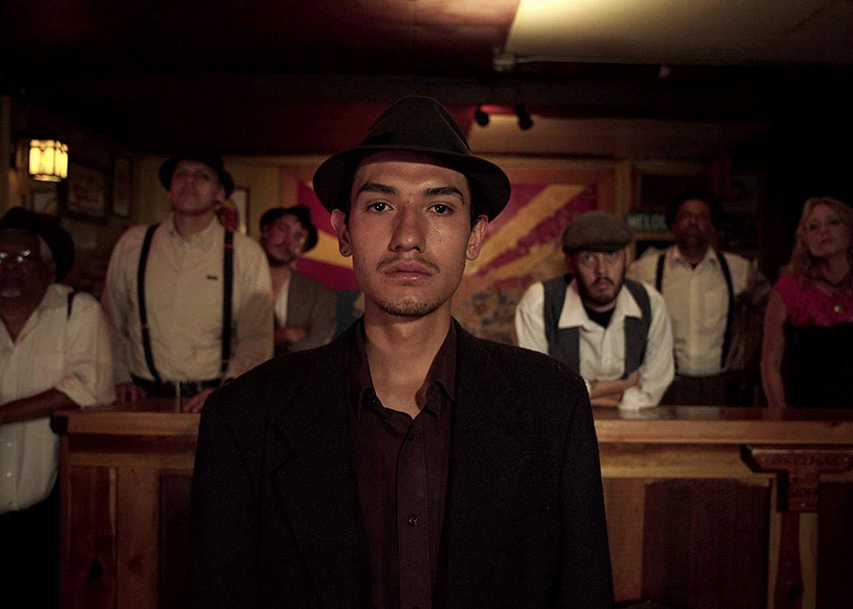 Miners in a room in a scene from Bisbee -17.