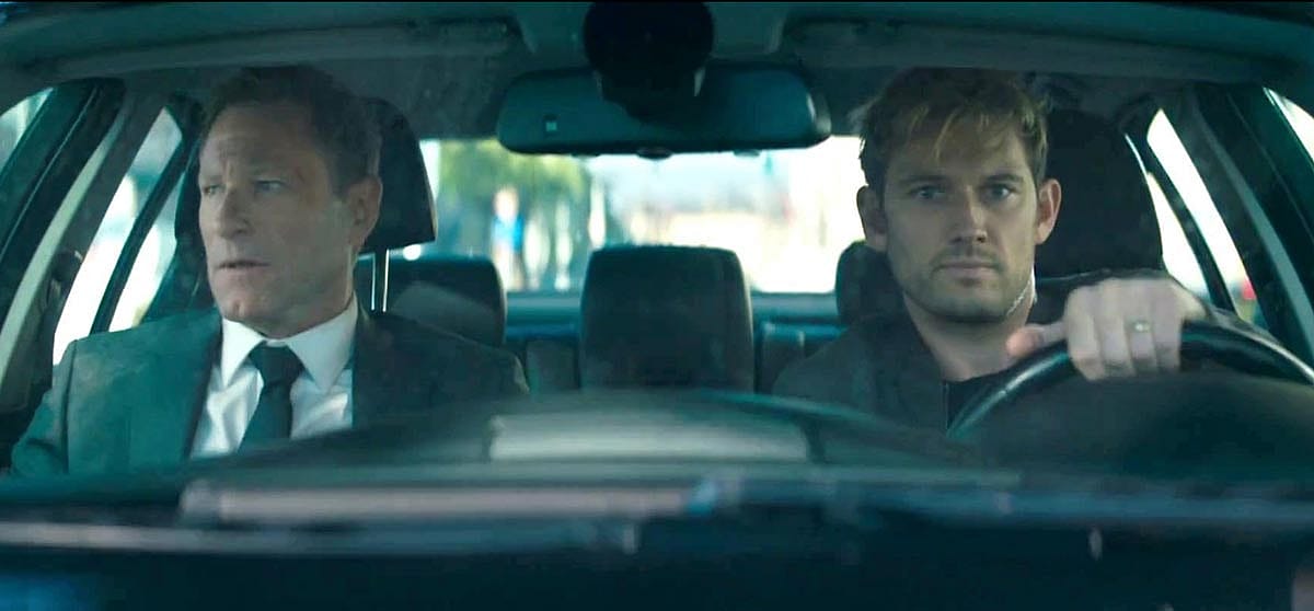 Aaron Eckhart and Alex Pettyfer in a still from Chief of Station 