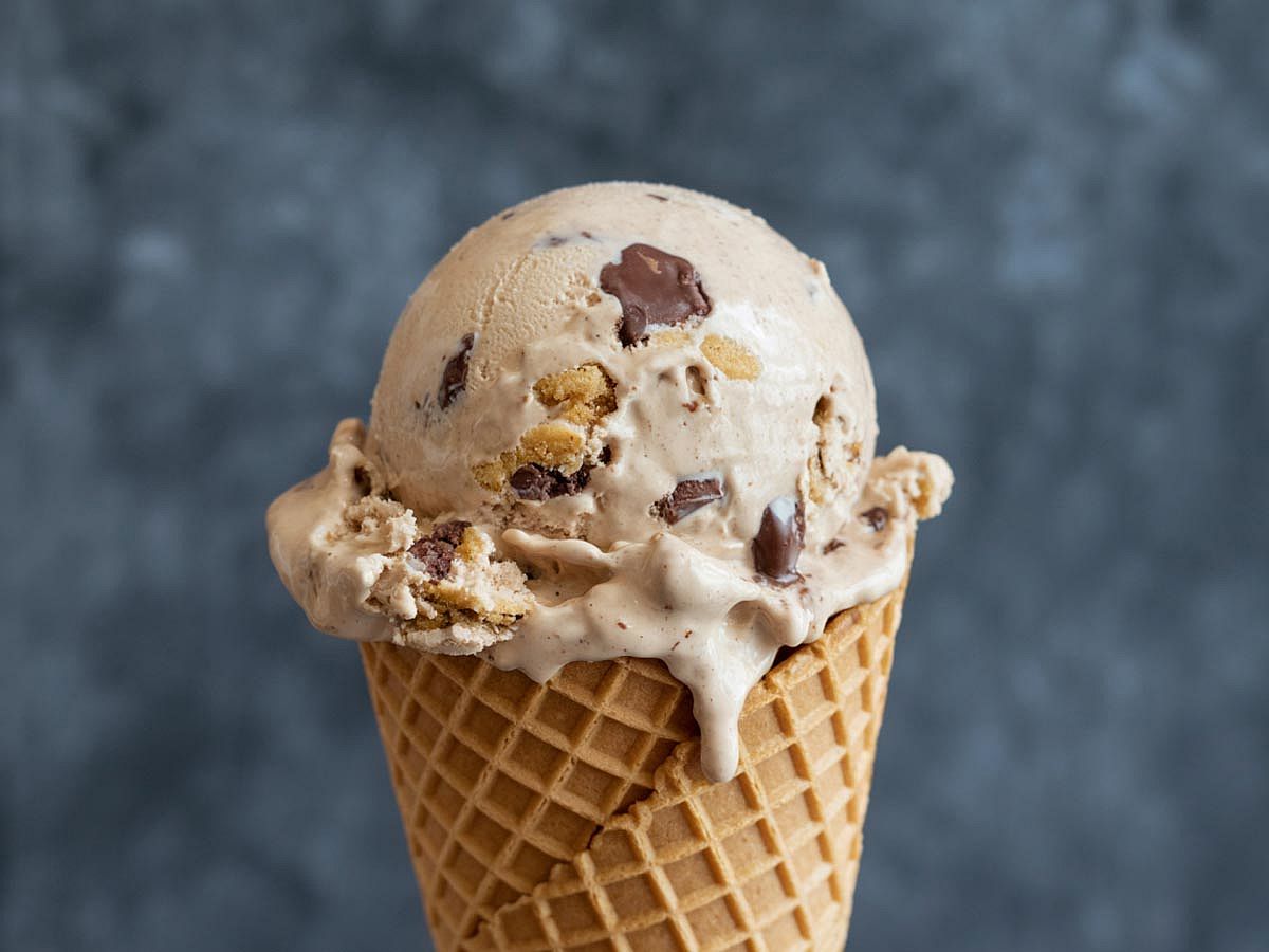 Chocolate chip cookie dough ice cream in a waffle cone.
