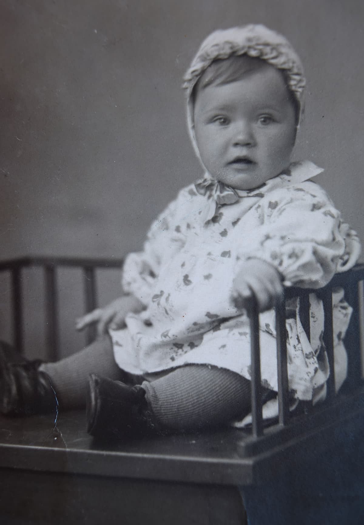 Vintage family photo of a toddler girl.