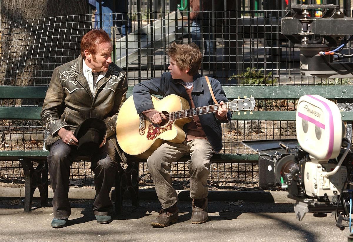 Robin Williams and Freddie Highmore perform on the movie set of "August Rush"