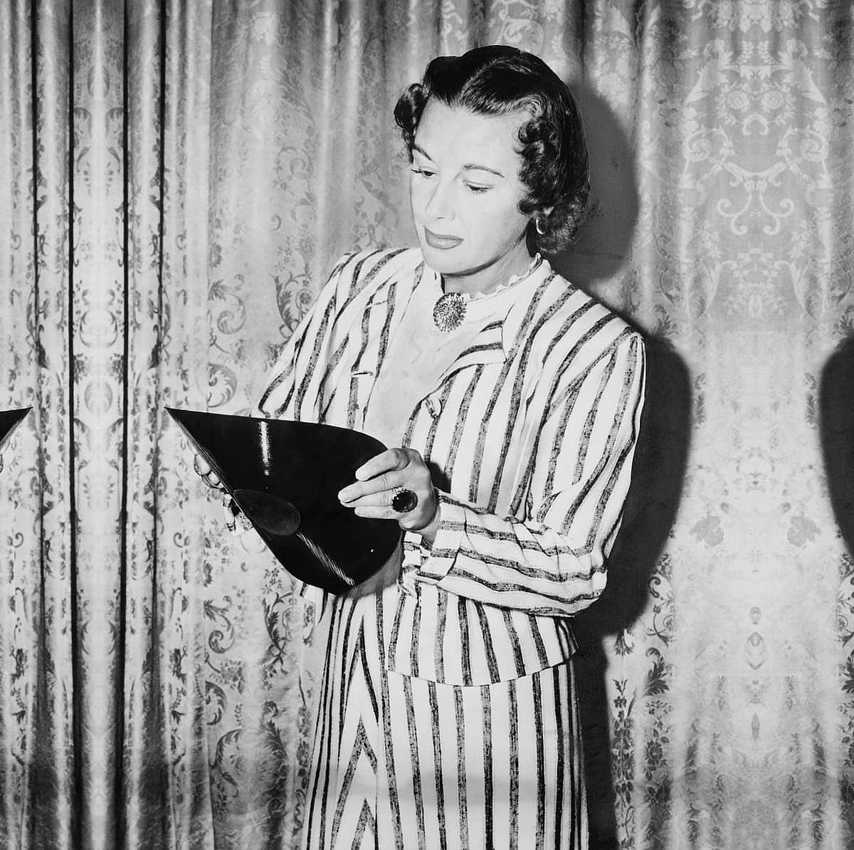 Trying to break the record, a young woman bends a gramophone record