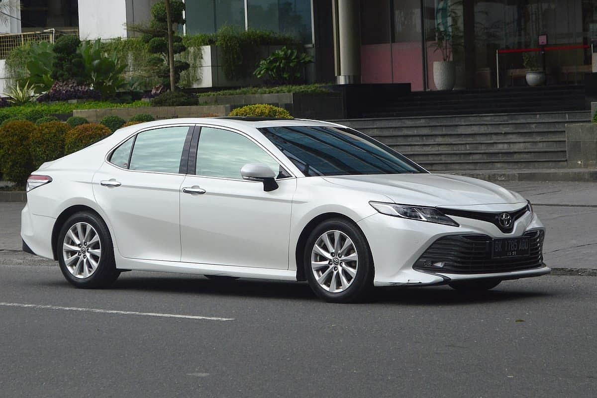White sedan 2020 Toyota Camry XV70 2.5V on the street.