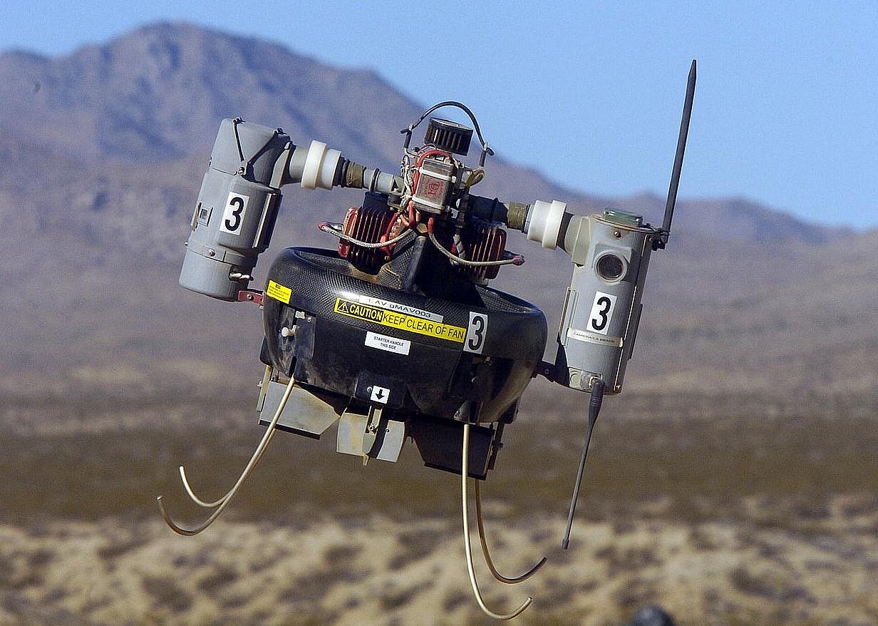 Pictured: The Honeywell RQ-16 T-Hawk Micro Air Vehicle (MAV) flies over a simulated combat area during an operational test flight